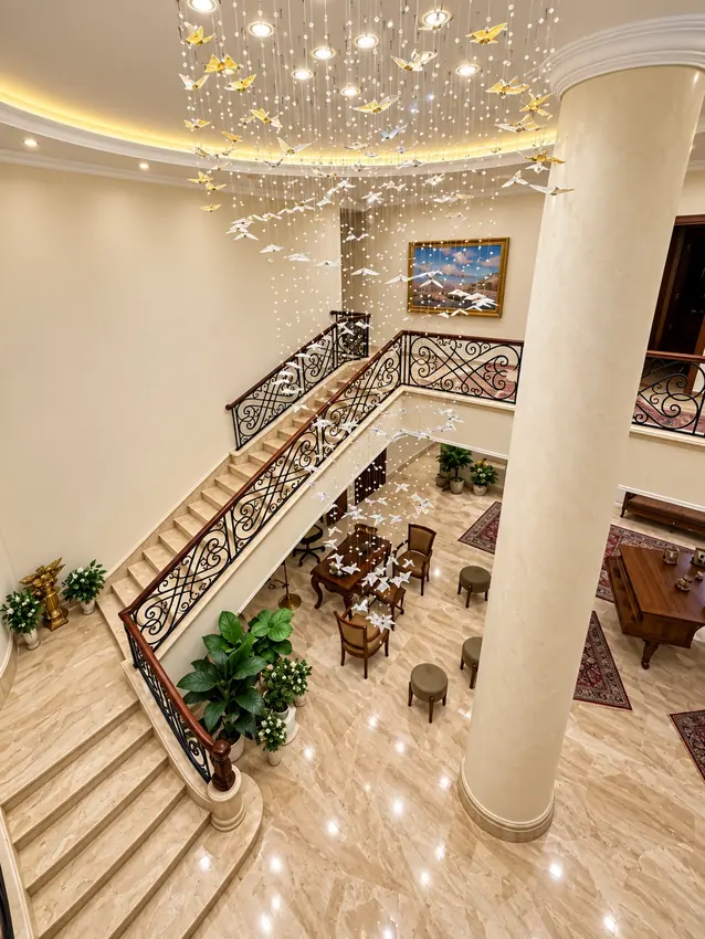 Amical Residence staircase chandelier